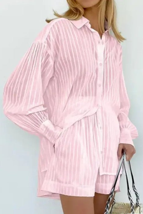 woman wearing pink color two piece set ; a Collared long sleeve shirt with striped pattern - Matching shorts with relaxed fit two-piece design for endless styling options