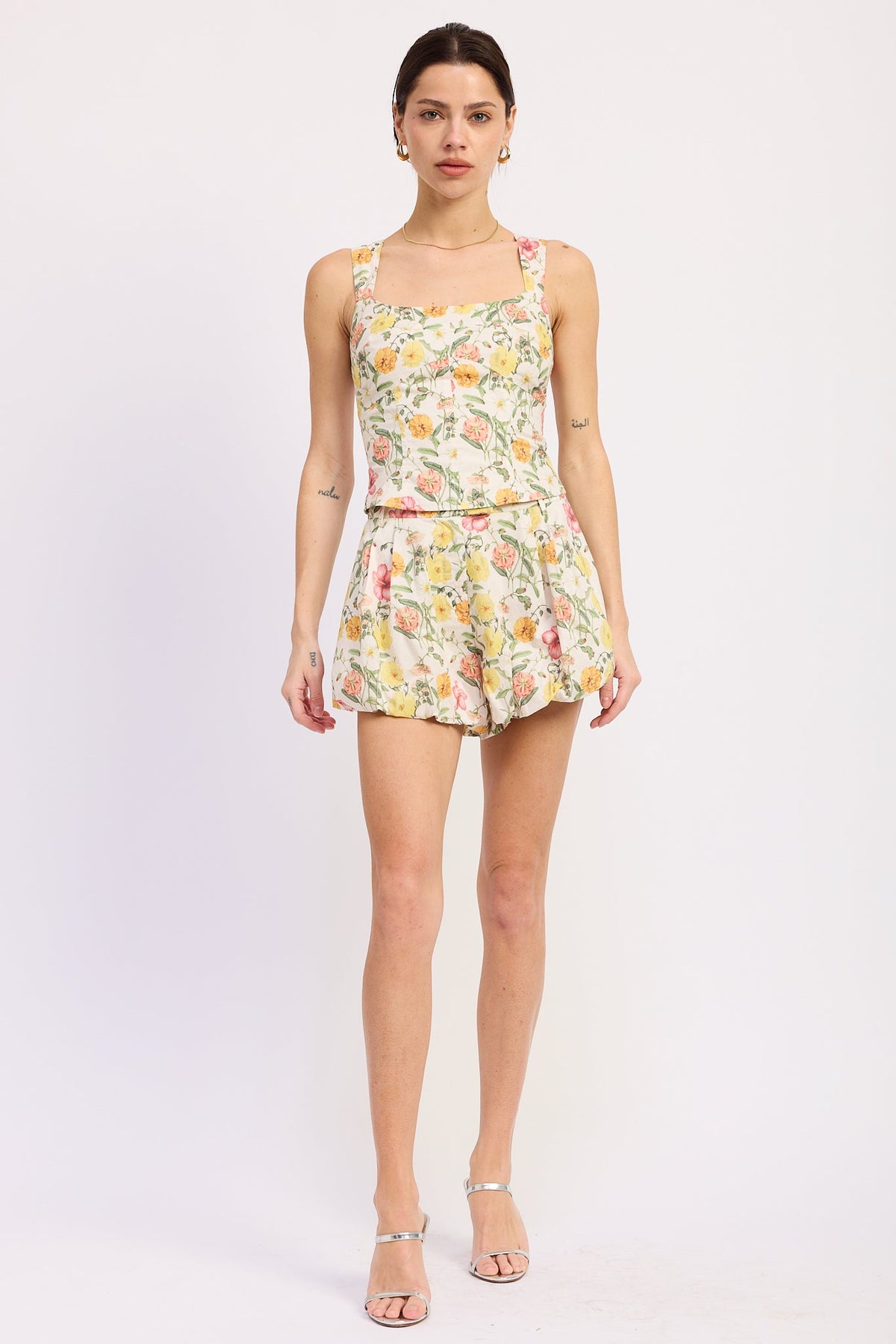 Woman wearing a floral dress on a white background