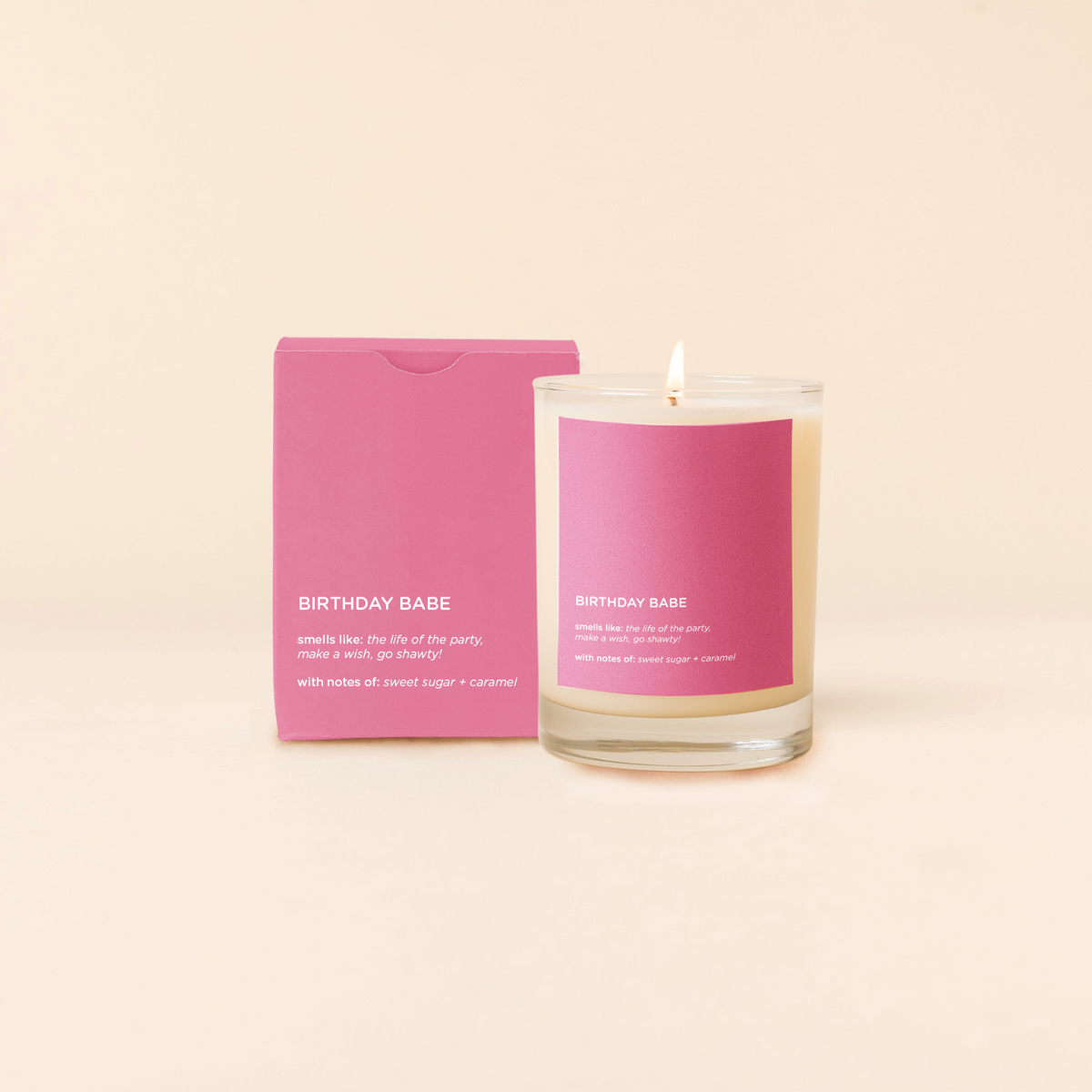 Candle and packaging with 'Birthday Babe' text on a beige background