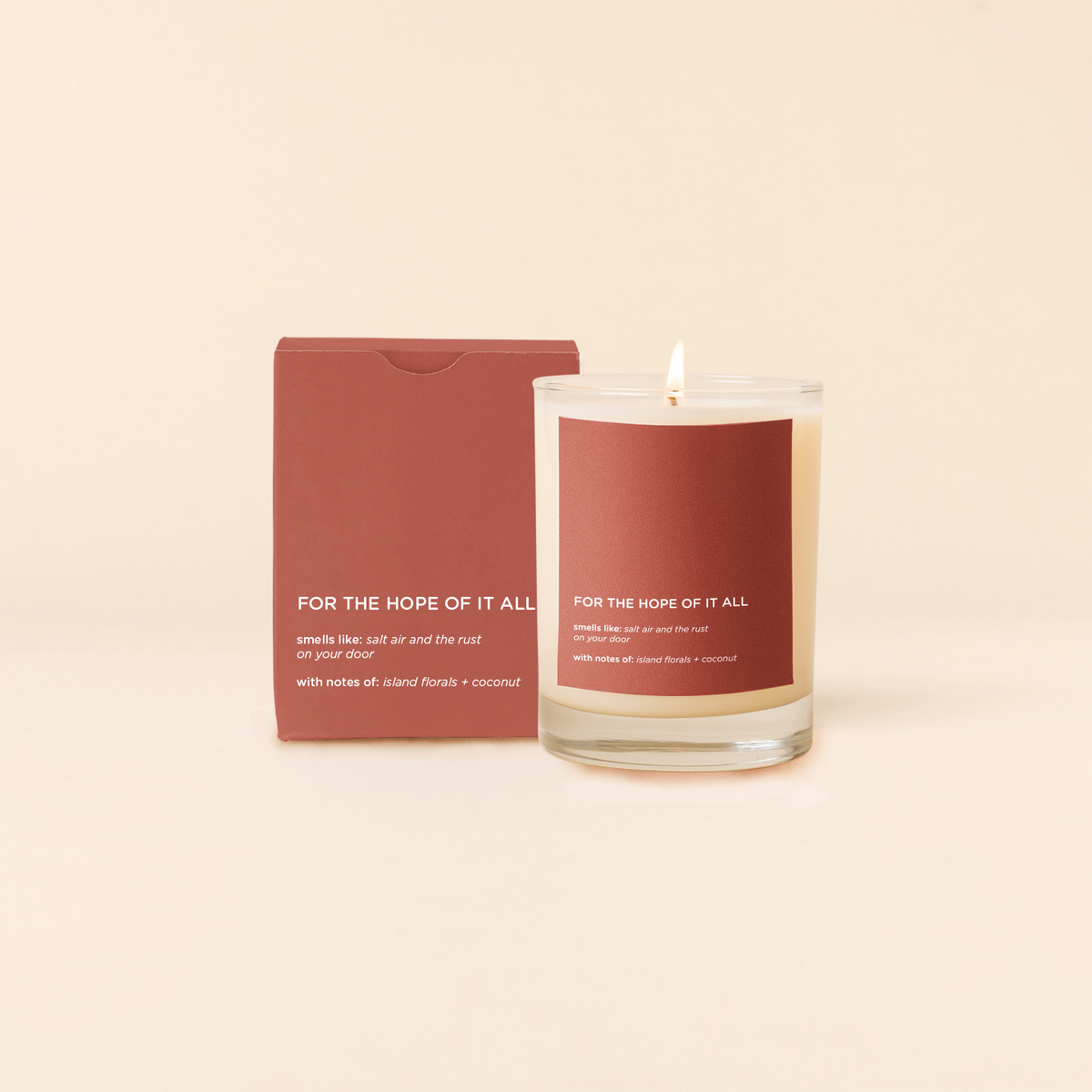 Hope Candle with a red label and packaging on a beige background
