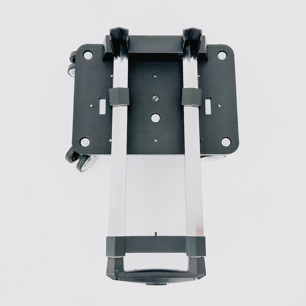 black metal bracket with wheels on a light gray background