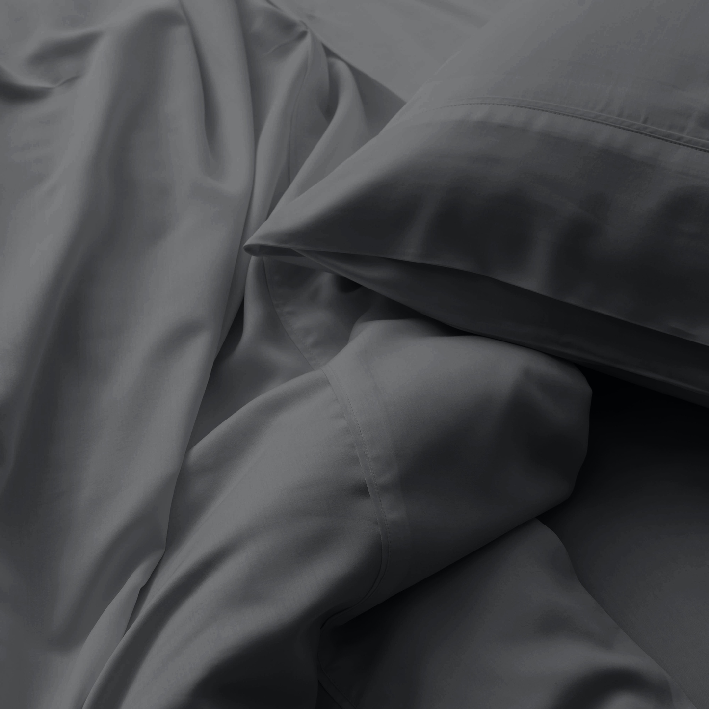 Close-up of dark gray fabric with folds