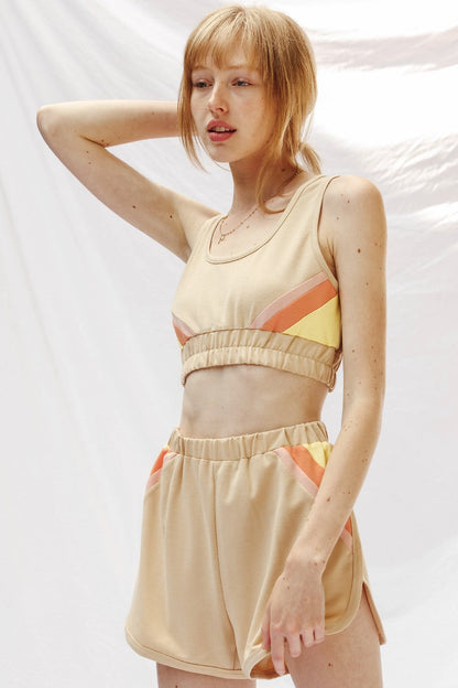  woman wearing a Retro Lounge Shorts Set ; shorts and sports bra style top