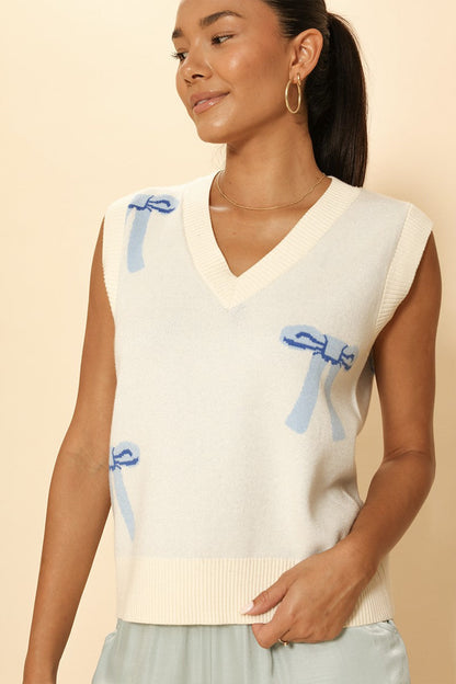 All Over Bow Knit Vest | Soft Pastel V-Neck Sweater Vest with Bow Design | Cute Feminine Layer for Every Season