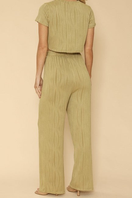 back view of woman woman wearing  Two-Piece Set: Pleated Crop Top & Wide-Leg Pants for Effortless Style  in green