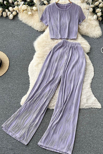 woman wearing  Two-Piece Set: Pleated Crop Top & Wide-Leg Pants for Effortless Style  in purple