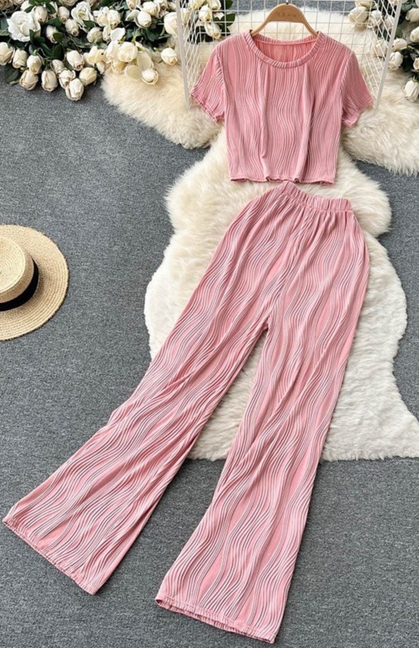 woman wearing  Two-Piece Set: Pleated Crop Top & Wide-Leg Pants for Effortless Style  in pink