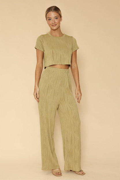 woman wearing  Two-Piece Set: Pleated Crop Top & Wide-Leg Pants for Effortless Style  in green