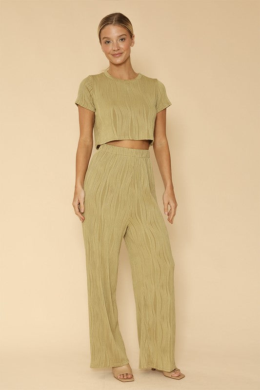 woman wearing  Two-Piece Set: Pleated Crop Top & Wide-Leg Pants for Effortless Style  in green