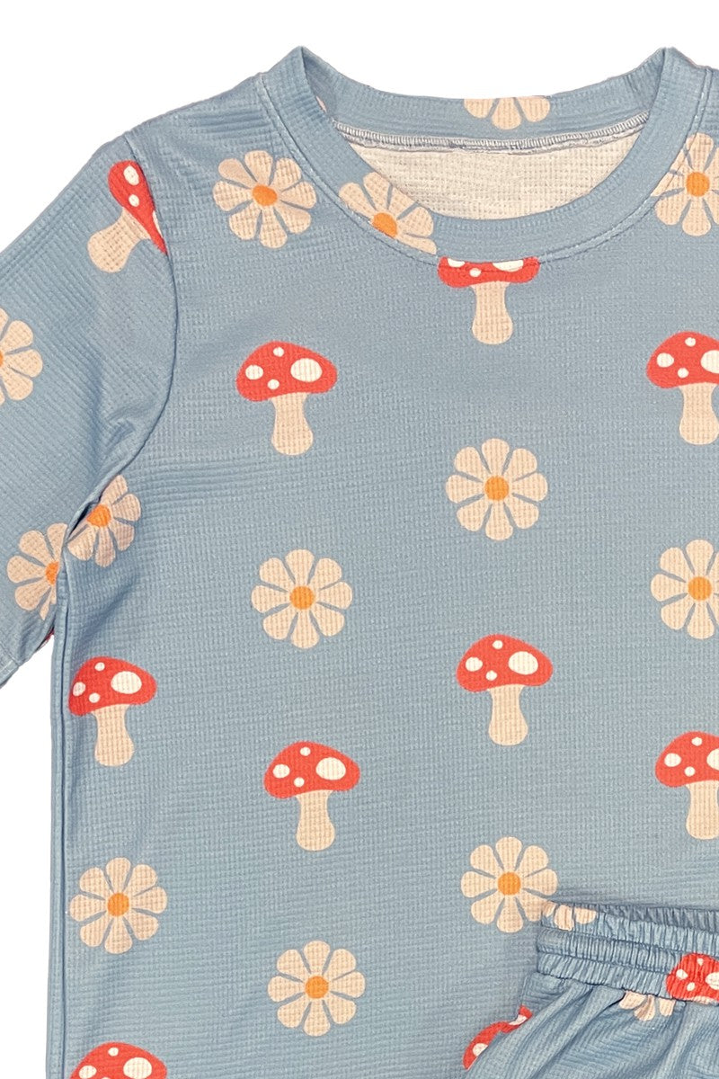 womens and girls outfit with mushroom and flower pattern on a blue background