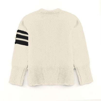 Beige sweater with black and white striped sleeve on a white background