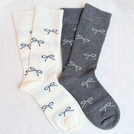 Add a touch of elegance to your outfit with our Bow Minimalist Socks Set of 2. Soft, stylish, and neutral — perfect for everyday or workwear loo