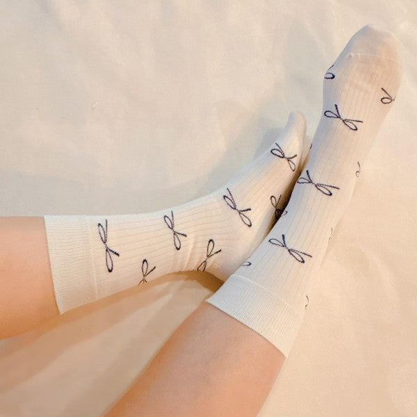 Add a touch of elegance to your outfit with our Bow Minimalist Socks Set of 2. Soft, stylish, and neutral — perfect for everyday or workwear loo