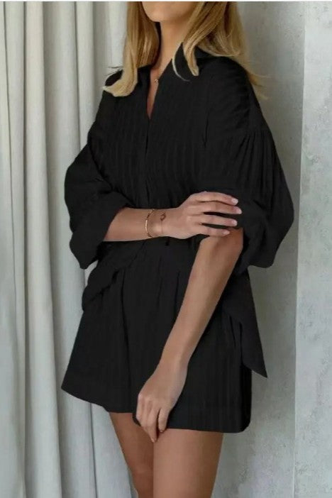 woman wearing black color two piece set ; a Collared long sleeve shirt with striped pattern - Matching shorts with relaxed fit two-piece design for endless styling options