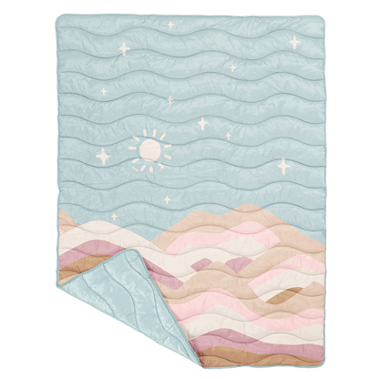 Baby puffy blanket  with wavy mountain and sun design on a light blue background