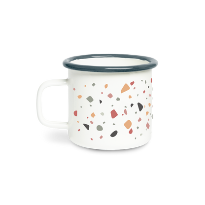 White mug with terrazzo pattern and blue rim on a white background