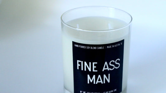Candle with a humorous label on a white background