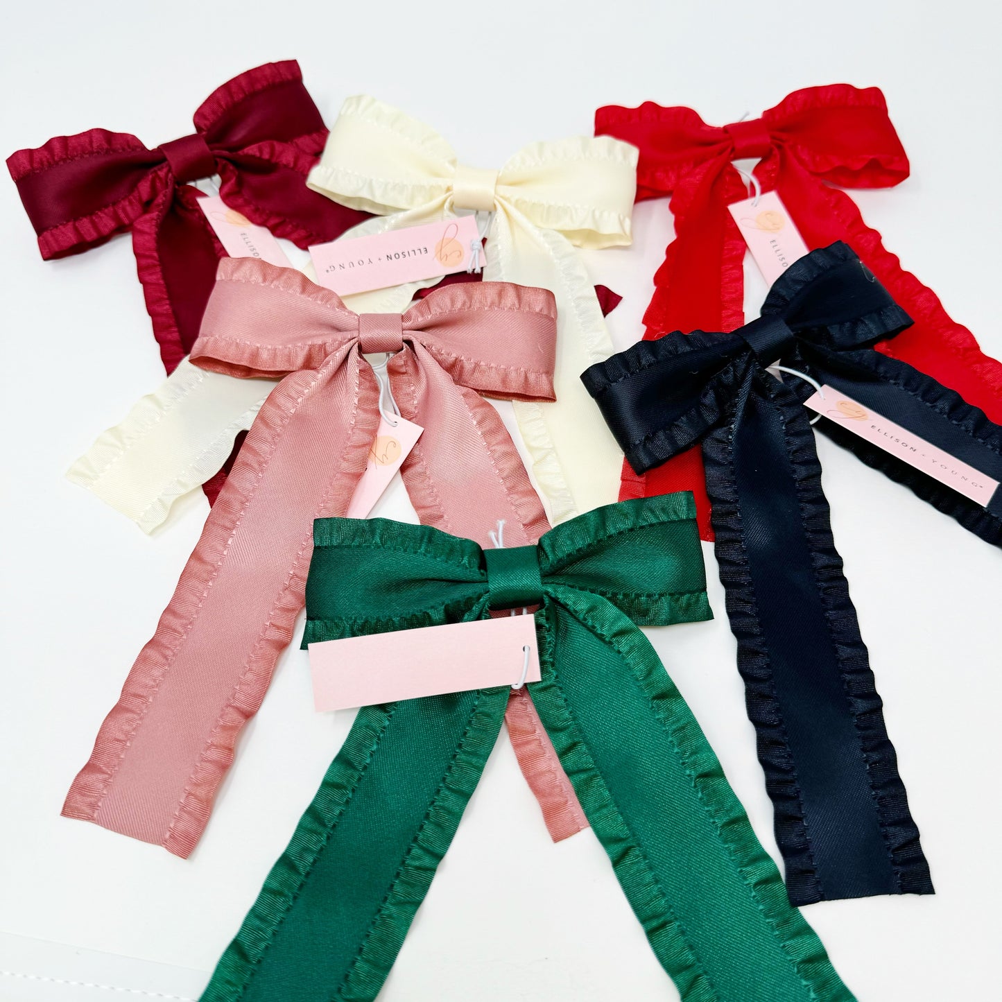 Collection of colorful Game Frill Bow Hair Clip for bow lovers, hair accessories must hav bows on a white background