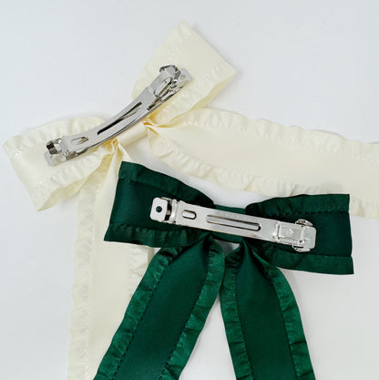 Two Game Frill Bow Hair Clip for bow lovers, hair accessories must have ribbons, one green and one white, on a white background.