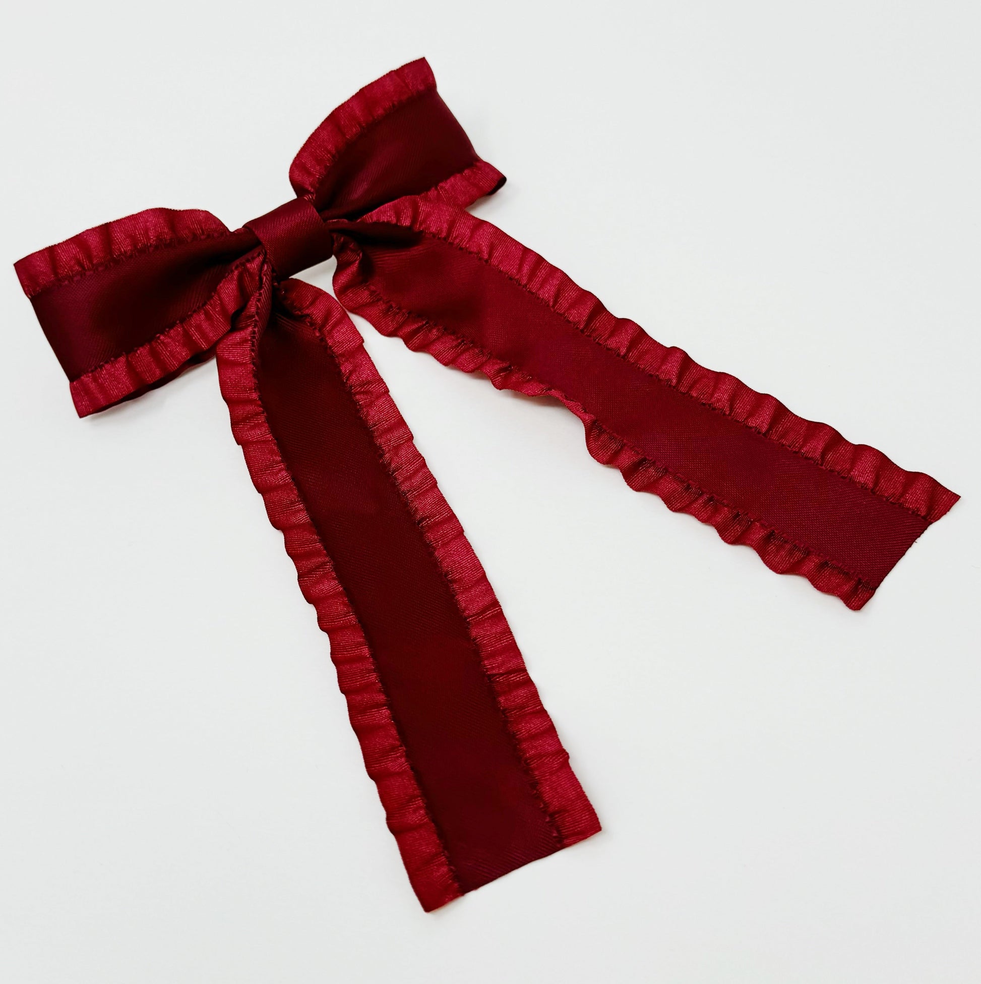 Red velvet Game Frill Bow Hair Clip for bow lovers, hair accessories must have bow on a white background