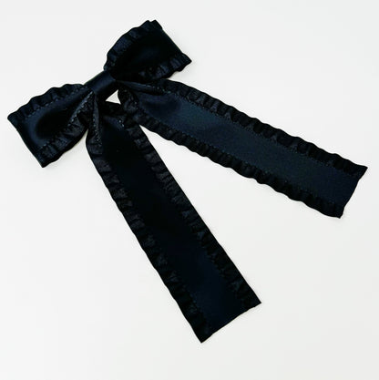 Black ruffled Game Frill Bow Hair Clip for bow lovers, hair accessories must have ribbon on a white background
