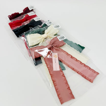 Packaged hair Game Frill Bow Hair Clip for bow lovers, hair accessories must have ribbons with colorful bows on a white background