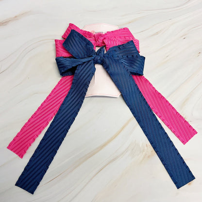 Blue and pink ribbons on a white background