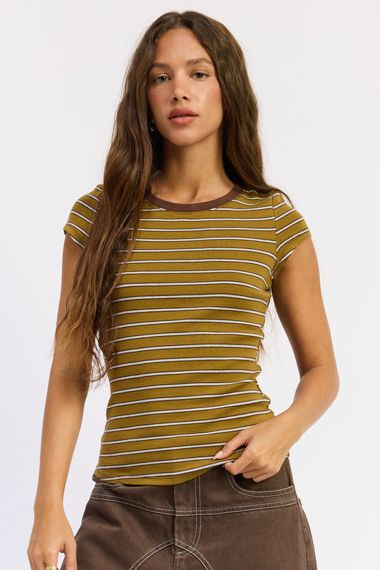 Woman wearing a striped shirt with a plain background