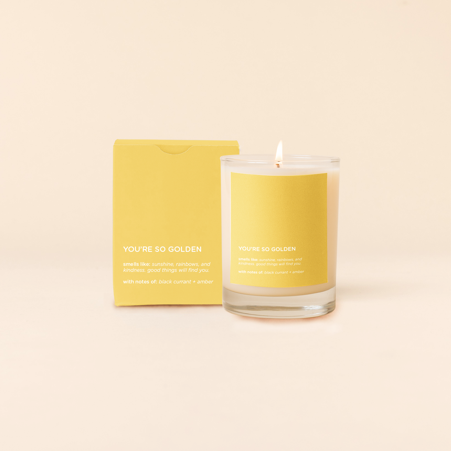 Candle and packaging with 'YOU'RE SO GOLDEN' text on a beige background
