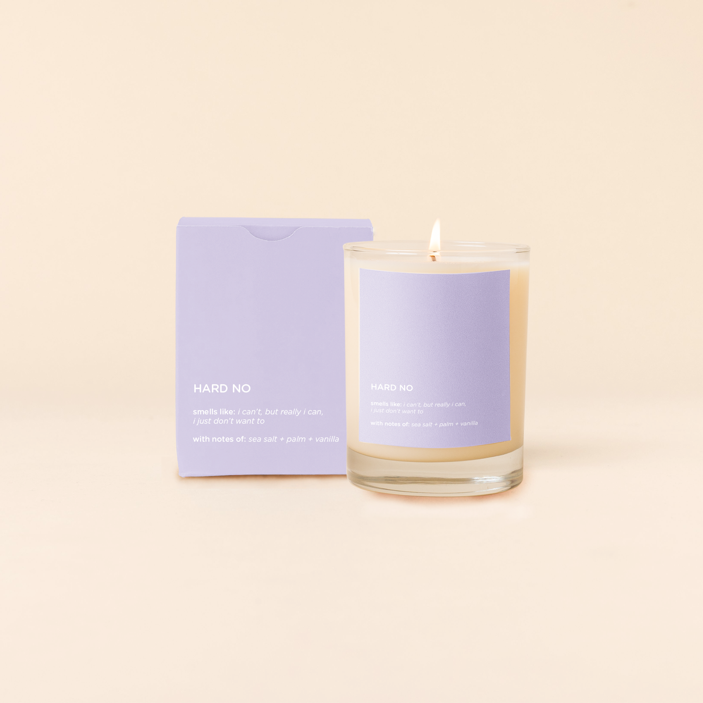 Hard No. Candle with a purple label and packaging on a beige background
