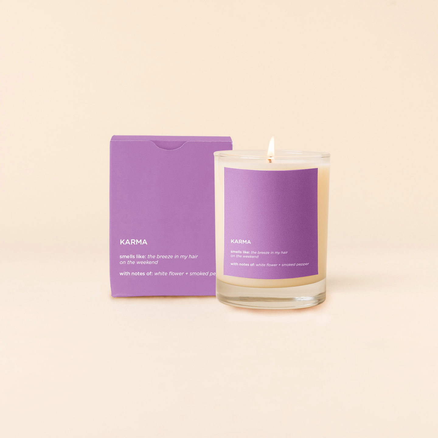 Candle with purple packaging labeled 'Karma' on a beige background