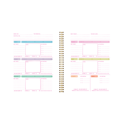 Spiral-bound planner with colorful sections on a white background