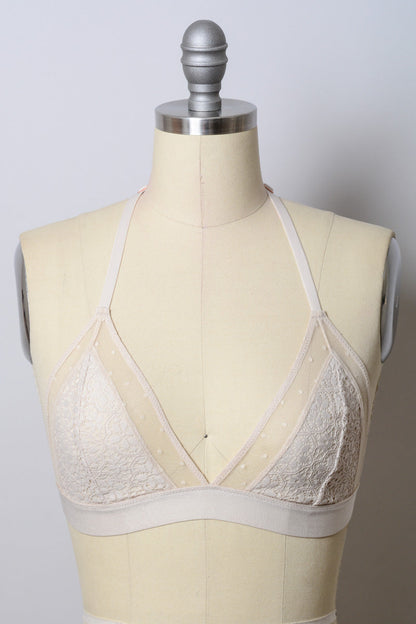Crochet T-back bralette by Leto Collection featuring natural color, soft knit fabric, and a stylish T-back design.