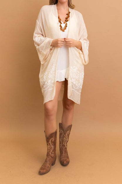 Blossom Breeze embroidered cream kimono with floral design.
