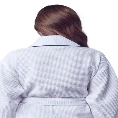 Person wearing a textured white Waffle Kimono Knee-Length robe  on a white background