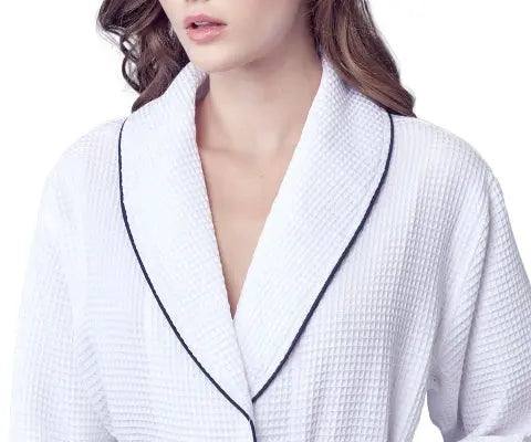 White textured Waffle Kimono Knee-Length robe  with black piping worn by a model on a white background