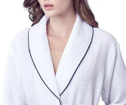 White textured Waffle Kimono Knee-Length robe  with black piping worn by a model on a white background