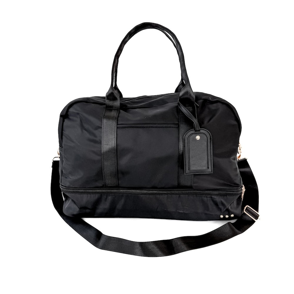 Black duffel bag with a strap on a white background