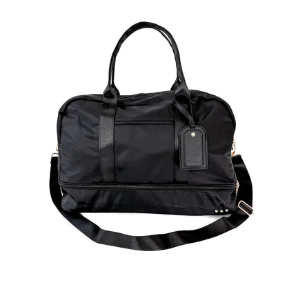 Black duffel bag with a strap on a white background