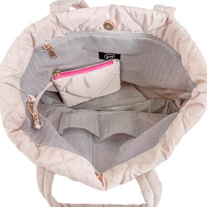 Pink quilted backpack with a zipper pocket on a white background