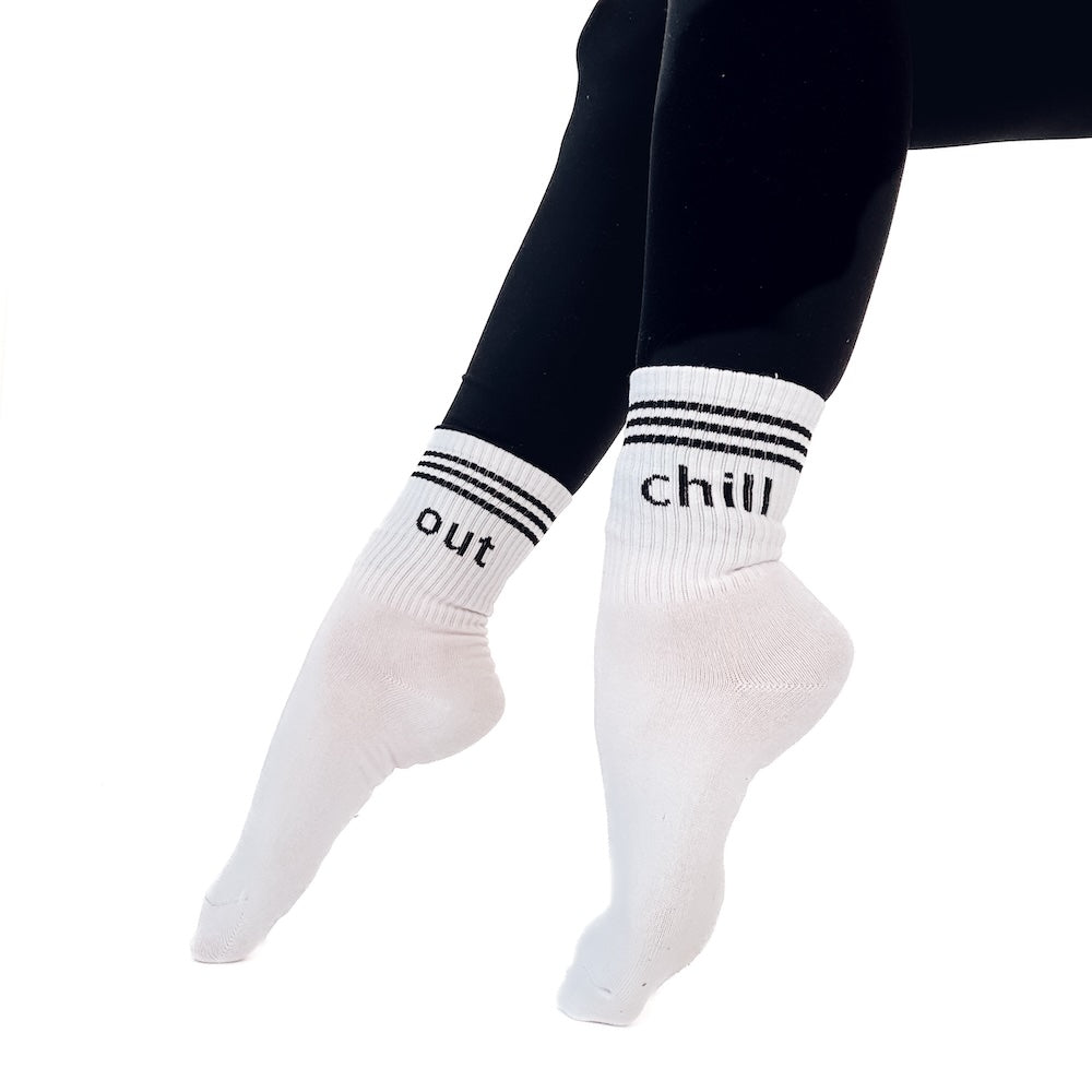 White socks with 'chill out' text on a white background