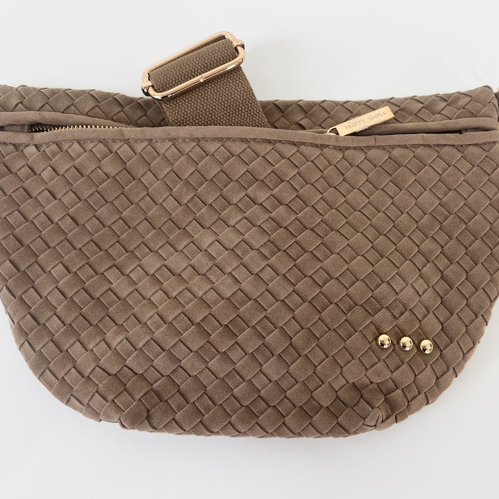 Brown woven fanny pack on a white background