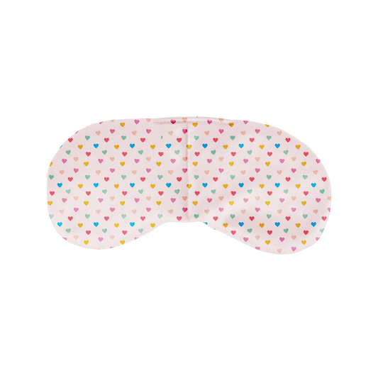 Sleep mask with colorful heart pattern on a white background