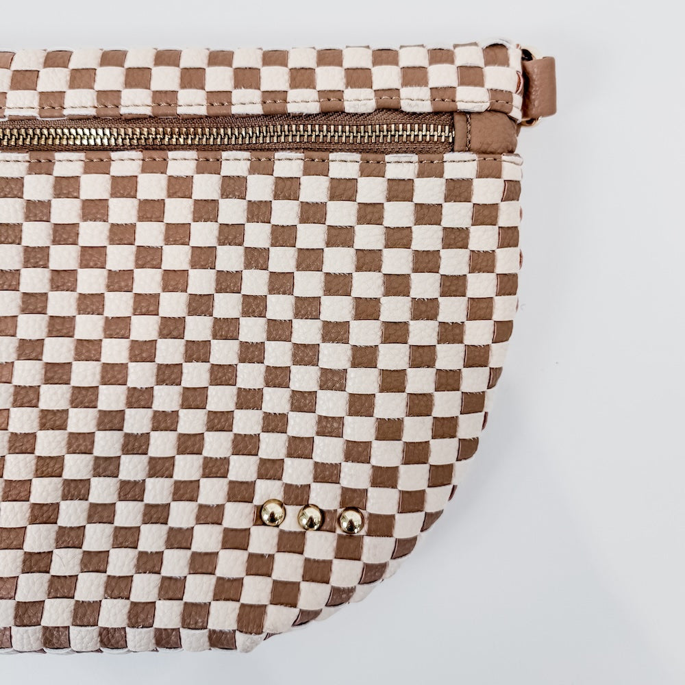 Checkered bag with brown and white pattern on a light gray background