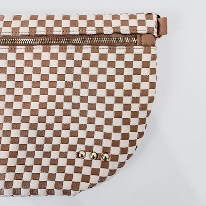 Checkered bag with brown and white pattern on a light gray background